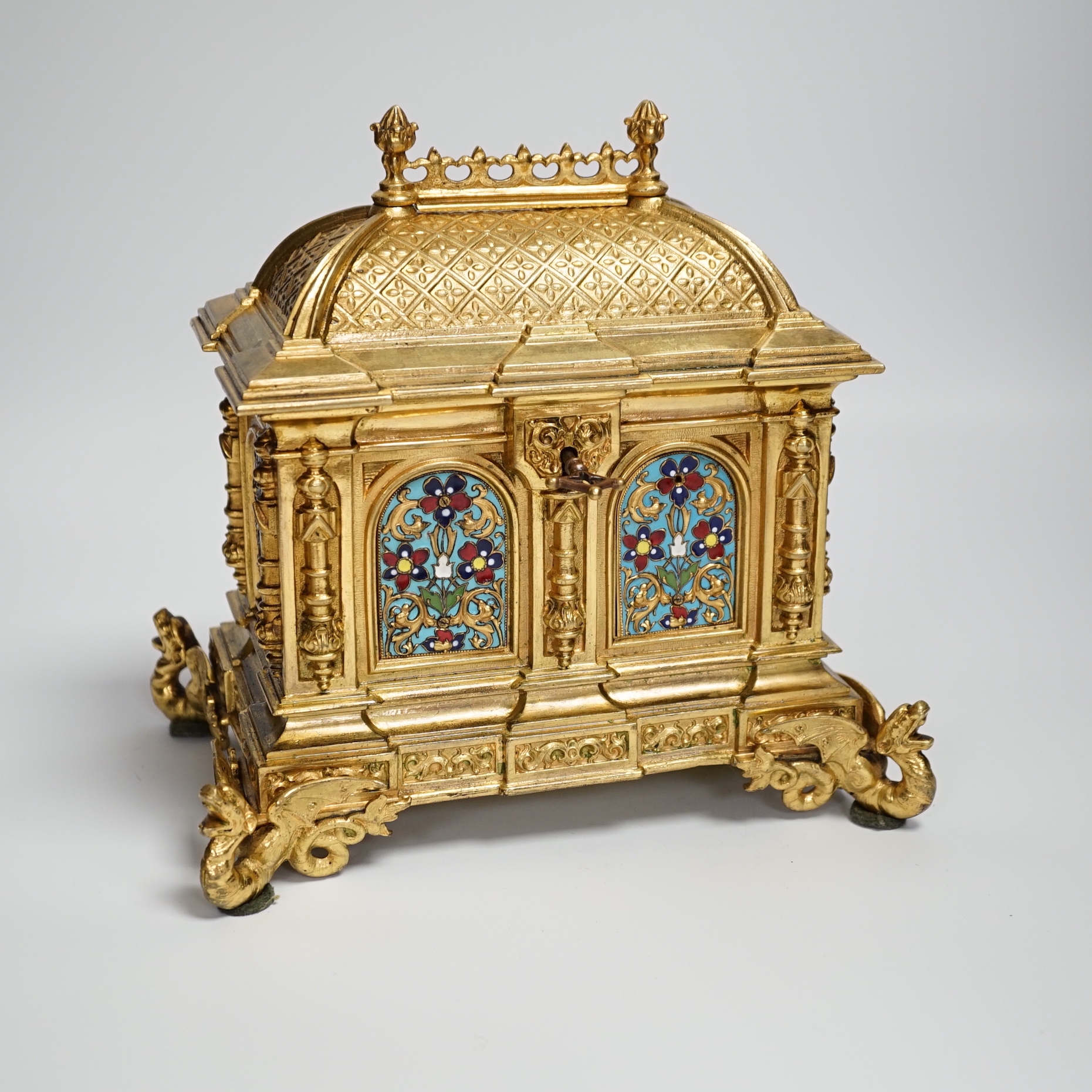 A cast brass and enamel casket 22cm high x 22cm wide